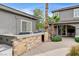 Outdoor kitchen and barbecue area, a convenient space for grilling and enjoying outdoor meals with Gathering and friends at 9108 Ghost Mountain Ave, Las Vegas, NV 89129