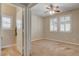 Bedroom with carpet, neutral walls, ceiling fan, and shuttered windows provides a calm and comfortable retreat at 9108 Ghost Mountain Ave, Las Vegas, NV 89129