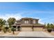 Charming two-story home featuring a three-car garage, desert landscaping, and a timeless architectural design at 9108 Ghost Mountain Ave, Las Vegas, NV 89129