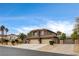 Attractive home boasts a spacious three-car garage, lush landscaping, and a private gated entrance, ensuring both curb appeal and security at 9108 Ghost Mountain Ave, Las Vegas, NV 89129