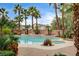 Beautiful backyard pool and spa surrounded by lush landscaping, creating a private and tranquil outdoor oasis at 9108 Ghost Mountain Ave, Las Vegas, NV 89129