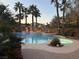 Tranquil pool featuring a hot tub and palm tree landscaping to create a relaxing oasis in the backyard at 9108 Ghost Mountain Ave, Las Vegas, NV 89129