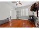 This bedroom features hardwood floors, a ceiling fan, and a closet with shoes and accessories at 9475 Castillana Ct, Las Vegas, NV 89147