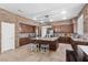 Well-equipped kitchen with island, stainless appliances, stone accent wall and ample cabinet space at 9475 Castillana Ct, Las Vegas, NV 89147