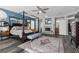 This main bedroom features wood floors, a four-poster bed, a sitting bench, and a fireplace at 9475 Castillana Ct, Las Vegas, NV 89147