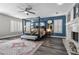 This main bedroom features wood floors, a four-poster bed, a sitting bench, and a fireplace at 9475 Castillana Ct, Las Vegas, NV 89147