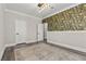 This room features hardwood floors, crown molding, neutral paint and a floral accent wall at 9475 Castillana Ct, Las Vegas, NV 89147