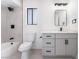 Bathroom featuring a shower/tub combo, grey vanity, and black hardware at 1009 N Tenaya Way, Las Vegas, NV 89128