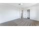 Bedroom featuring neutral carpet, closet, and a modern ceiling light at 1009 N Tenaya Way, Las Vegas, NV 89128