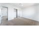 Bedroom featuring neutral carpet, closet, and a modern ceiling light at 1009 N Tenaya Way, Las Vegas, NV 89128