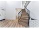 Inviting entryway features wood-look flooring, staircase, and neutral decor at 1009 N Tenaya Way, Las Vegas, NV 89128