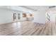 Open-concept living space with backyard access and adjacent kitchen area at 1009 N Tenaya Way, Las Vegas, NV 89128