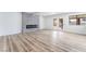 Spacious living room with modern electric fireplace and access to backyard at 1009 N Tenaya Way, Las Vegas, NV 89128