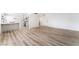 Bright, open living space featuring sleek floors and modern kitchen view at 1009 N Tenaya Way, Las Vegas, NV 89128