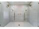 Luxurious walk-in shower with dual shower heads and tiled walls at 1009 N Tenaya Way, Las Vegas, NV 89128