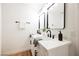 Bright bathroom features a double sink vanity with white countertop and modern black fixtures at 10229 Birch Bluff Ln, Las Vegas, NV 89145