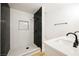 Modern bathroom featuring black hardware, and luxurious walk-in shower at 10229 Birch Bluff Ln, Las Vegas, NV 89145