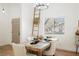 Dining area with a wooden table, ladder-back decor, and great lighting for a cozy meal at 10229 Birch Bluff Ln, Las Vegas, NV 89145