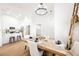 Inviting, spacious open concept space with a modern kitchen, dining area, and neutral tones throughout at 10229 Birch Bluff Ln, Las Vegas, NV 89145