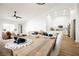 An expansive open concept floor plan joining a modern kitchen, dining area, and a cozy living space at 10229 Birch Bluff Ln, Las Vegas, NV 89145