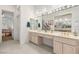 Bright bathroom with double sinks, vanity area, and access to the bedroom at 10548 Findlay Ave, Las Vegas, NV 89134