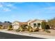 Stunning single-story home with a desert landscape, tile roof, and attached two car garage at 10548 Findlay Ave, Las Vegas, NV 89134