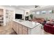 Open layout showing the kitchen, and living area with a fireplace feature at 10548 Findlay Ave, Las Vegas, NV 89134