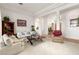 Spacious living room featuring a cozy seating area and views of the entry at 10548 Findlay Ave, Las Vegas, NV 89134