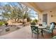 Cozy covered patio with ample seating and views of the landscaped backyard at 10548 Findlay Ave, Las Vegas, NV 89134