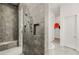 Bathroom featuring a modern shower with built-in shelves and a rainfall shower head at 10794 White Clay Dr, Las Vegas, NV 89135