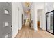 A grand entryway featuring hardwood floors, high ceilings, and modern decor at 10794 White Clay Dr, Las Vegas, NV 89135