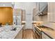 A modern kitchen features stainless steel appliances, a center island, and light wood cabinets at 10794 White Clay Dr, Las Vegas, NV 89135