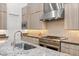 Well-equipped kitchen with granite countertops, stainless steel appliances, and custom cabinets, ideal for cooking at 10794 White Clay Dr, Las Vegas, NV 89135