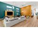 Bright living room with modern furniture, fireplace, and large windows providing ample natural light at 10794 White Clay Dr, Las Vegas, NV 89135