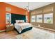 Comfortable main bedroom with natural light, a ceiling fan, and a king bed at 10794 White Clay Dr, Las Vegas, NV 89135
