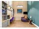 Office area with built-in shelving and a comfortable chair at 10794 White Clay Dr, Las Vegas, NV 89135