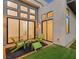 Inviting outdoor patio featuring comfortable seating, lush turf, and seamless indoor-outdoor flow at 10794 White Clay Dr, Las Vegas, NV 89135