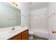 Bright bathroom featuring a single sink vanity and shower-tub combination at 1333 Pinto Rock Ln # 202, Las Vegas, NV 89128