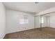 Neutral bedroom with carpeted floors and a mirrored sliding door closet at 1333 Pinto Rock Ln # 202, Las Vegas, NV 89128
