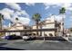 Well-maintained condo complex with mature palm trees and assigned covered parking at 1333 Pinto Rock Ln # 202, Las Vegas, NV 89128