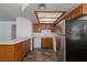 Functional kitchen with wood cabinets, laminate countertops, and white appliances at 1333 Pinto Rock Ln # 202, Las Vegas, NV 89128