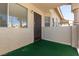 Private patio with a dark metal security door, outdoor light, and window at 1333 Pinto Rock Ln # 202, Las Vegas, NV 89128