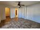 Spacious bedroom with neutral walls, ceiling fan, and linoleum flooring at 1904 Las Palmas Ln # 101, Laughlin, NV 89029