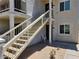 Condo exterior featuring stairs to the second floor, showing the building's entrance and facade at 1904 Las Palmas Ln # 101, Laughlin, NV 89029