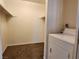 Walk-in closet with laundry area featuring a washing machine and storage shelves at 1904 Las Palmas Ln # 101, Laughlin, NV 89029