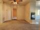Spacious living room with a fireplace and plush carpeting at 1904 Las Palmas Ln # 101, Laughlin, NV 89029