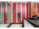 Modern bathroom features colorful striped wallpaper, vanity and glass enclosed shower at 200 W Sahara Ave # 4101, Las Vegas, NV 89102