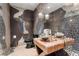 Unique bathroom with decorative walls, stone countertop, and modern fixtures at 200 W Sahara Ave # 4101, Las Vegas, NV 89102