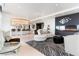 Open-concept living area featuring a fireplace, bar, and zebra print rug at 200 W Sahara Ave # 4101, Las Vegas, NV 89102