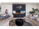 Cozy living room showcasing a modern fireplace, comfortable seating, and unique decor at 200 W Sahara Ave # 4101, Las Vegas, NV 89102